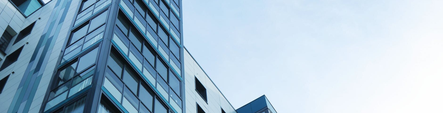 low angle view of office building against sky